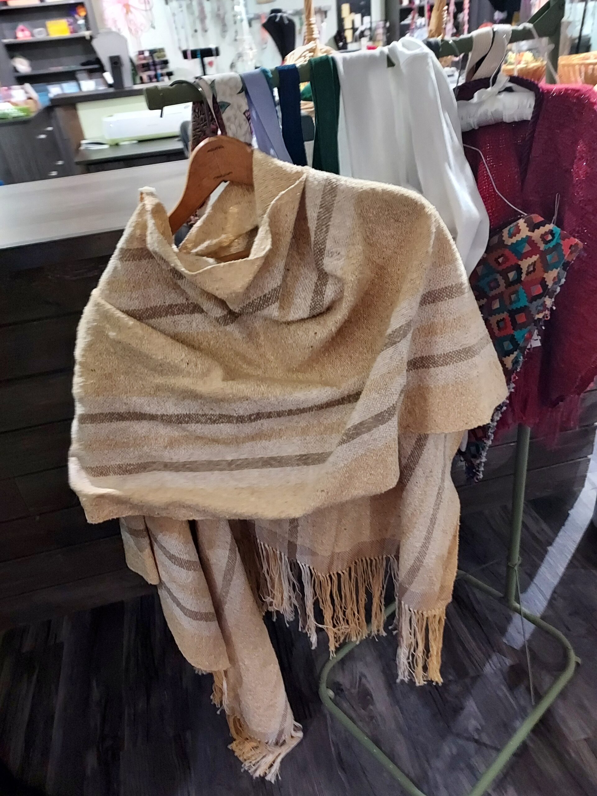 Photo of beige and cream poncho outfit created by Rainbow Acres rancher Kelly